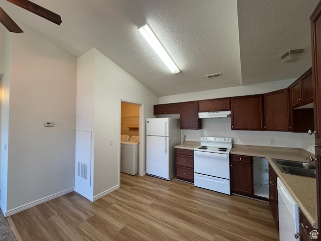 8048 W Copperfield Pl # 31, Magna, UT 84044 - kitchen with white appliances, independent washer and dryer, vaulted ceiling, light wood-style flooring, and under cabinet range hood
