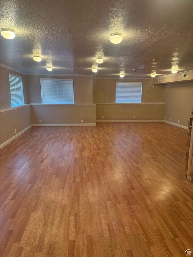 8048 W Copperfield Pl # 31, Magna, UT 84044 - spare room featuring wood finished floors and a textured ceiling