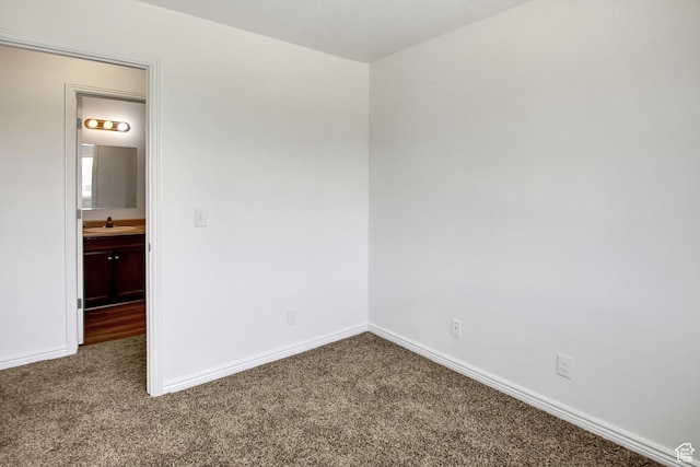 8048 W Copperfield Pl # 31, Magna, UT 84044 - carpeted spare room featuring baseboards and a sink