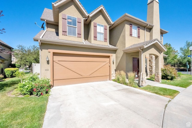 960 E 6740 S, Midvale, UT 84047 - view of front of house with stucco siding, concrete driveway, a chimney, an attached garage, and a front yard