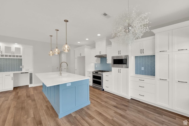 960 E 6740 S, Midvale, UT 84047 - kitchen with stainless steel appliances, tasteful backsplash, recessed lighting, light countertops, and light wood-style flooring