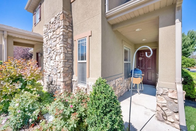 960 E 6740 S, Midvale, UT 84047 - doorway to property featuring stone siding and stucco siding