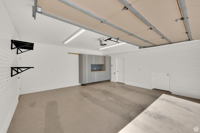 960 E 6740 S, Midvale, UT 84047 - garage featuring a garage door opener and baseboards