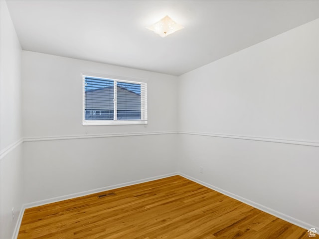 828 E Hibiscus Ave, Sandy, UT 84094 - unfurnished room with baseboards and wood finished floors