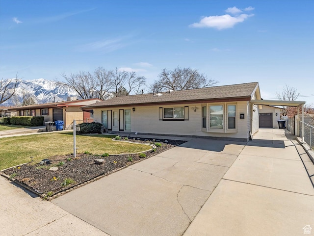 828 E Hibiscus Ave, Sandy, UT 84094 - single story home with a mountain view, concrete driveway, brick siding, and an attached carport