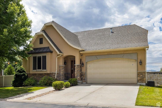 5588 S Farm Hill Dr, Salt Lake City, UT 84117 - view of front of house featuring stone siding, a garage, stucco siding, concrete driveway, and a standing seam roof