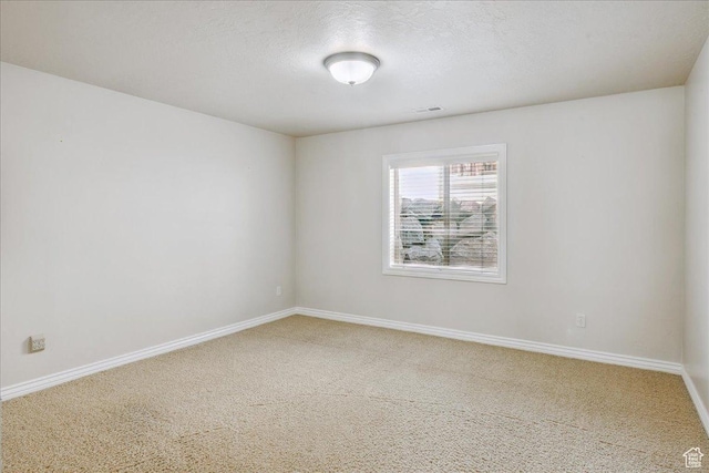 5588 S Farm Hill Dr, Salt Lake City, UT 84117 - carpeted spare room with baseboards and a textured ceiling