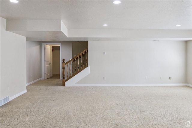 5588 S Farm Hill Dr, Salt Lake City, UT 84117 - carpeted spare room featuring recessed lighting, stairway, and a textured ceiling