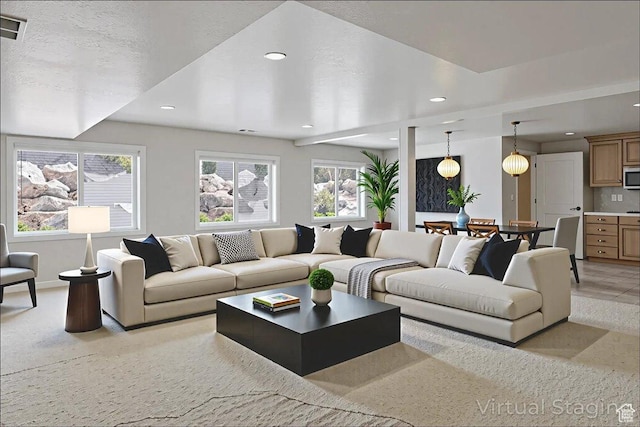 5588 S Farm Hill Dr, Salt Lake City, UT 84117 - living area with plenty of natural light, recessed lighting, and light colored carpet