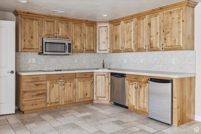 5588 S Farm Hill Dr, Salt Lake City, UT 84117 - kitchen with appliances with stainless steel finishes, decorative backsplash, tile countertops, light stone finish floors, and recessed lighting