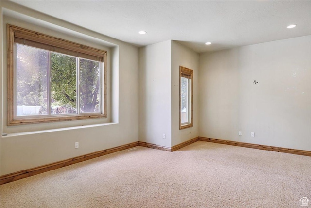 5588 S Farm Hill Dr, Salt Lake City, UT 84117 - empty room with light carpet and recessed lighting