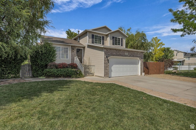 5548 S 3850 W, Roy, UT 84067 - split level home with an attached garage, brick siding, and concrete driveway