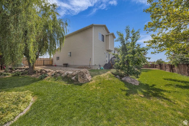 5548 S 3850 W, Roy, UT 84067 - view of side of home featuring a fenced backyard