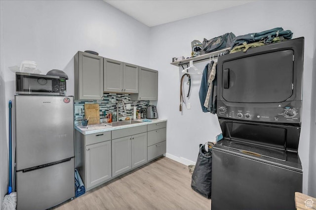 331 W 1910 S, Hurricane, UT 84737 - laundry area with stacked washing machine and dryer and light wood-style flooring