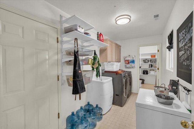 331 W 1910 S, Hurricane, UT 84737 - laundry room featuring washing machine and dryer, light floors, and cabinet space