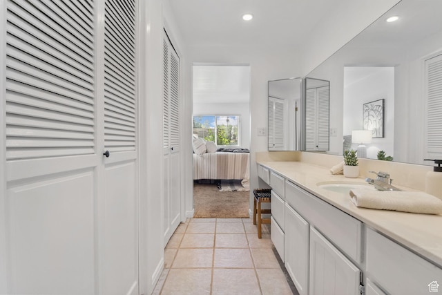 5704 S Waterbury Way Unit H, Murray, UT 84121 - bathroom with a closet, vanity, connected bathroom, tile patterned flooring, and recessed lighting