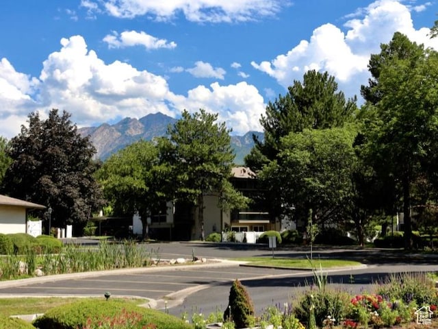 5704 S Waterbury Way Unit H, Murray, UT 84121 - view of asphalt street with a mountain view and curbs