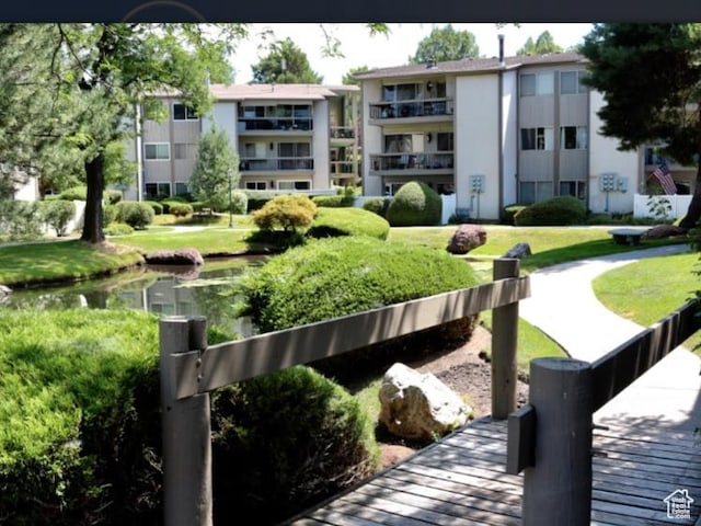 5704 S Waterbury Way Unit H, Murray, UT 84121 - surrounding community with a lawn