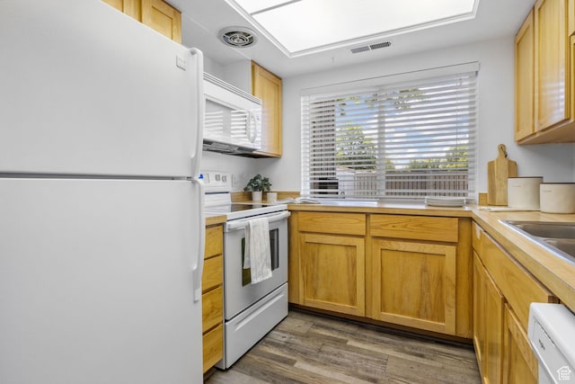 5704 S Waterbury Way Unit H, Murray, UT 84121 - kitchen with white appliances, light countertops, and light wood-type flooring