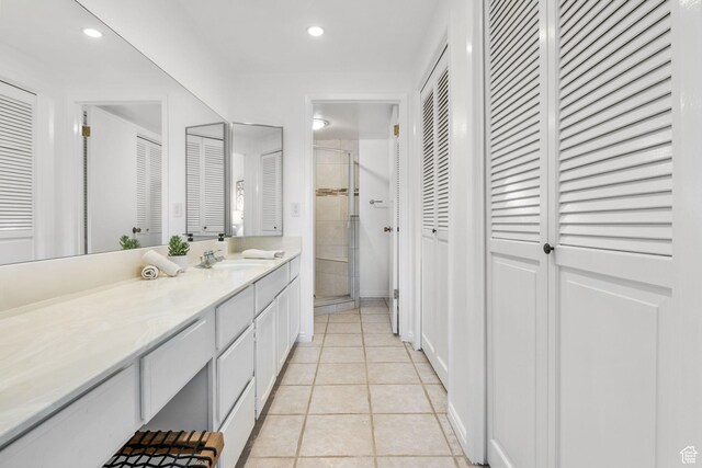 5704 S Waterbury Way Unit H, Murray, UT 84121 - full bathroom with a closet, a stall shower, vanity, tile patterned flooring, and recessed lighting