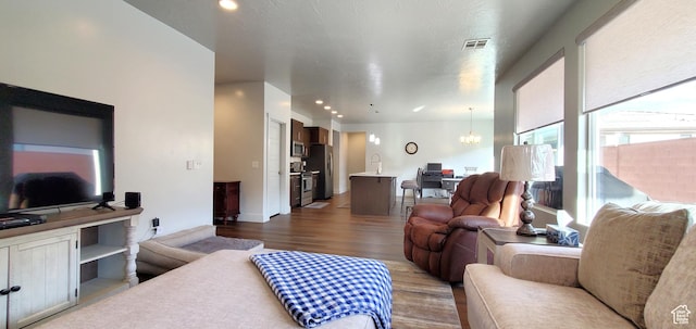 3040 E Lavatera Dr S, St George, UT 84790 - living area featuring dark wood-style flooring, a chandelier, and recessed lighting