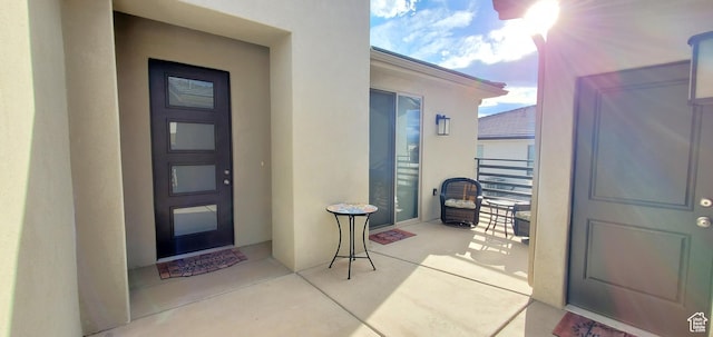 3040 E Lavatera Dr S, St George, UT 84790 - entrance to property featuring stucco siding and a balcony