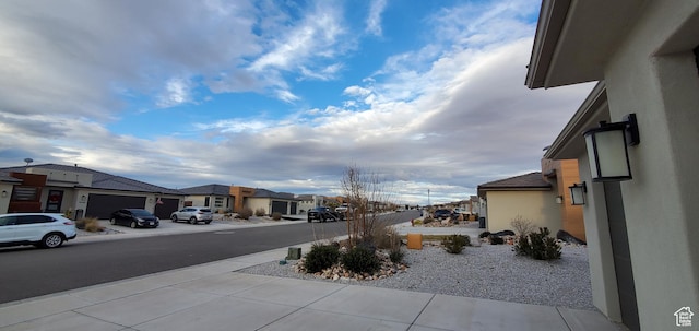3040 E Lavatera Dr S, St George, UT 84790 - view of asphalt street featuring a residential view and sidewalks