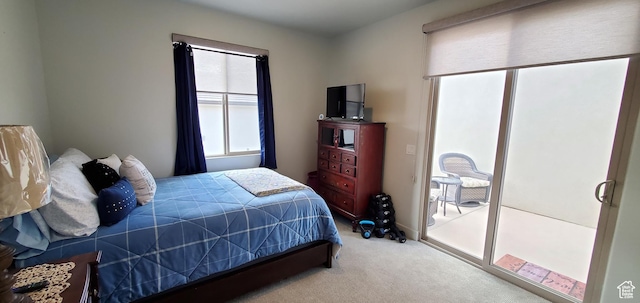 3040 E Lavatera Dr S, St George, UT 84790 - carpeted bedroom with multiple windows and access to outside