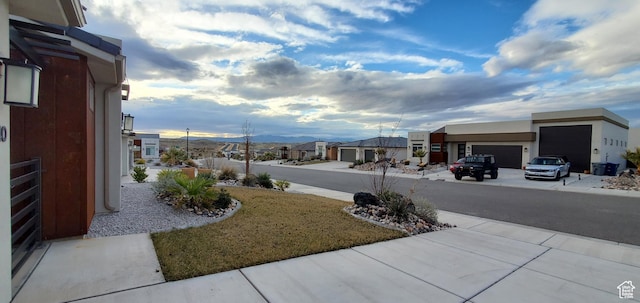 3040 E Lavatera Dr S, St George, UT 84790 - view of yard featuring a garage and a residential view
