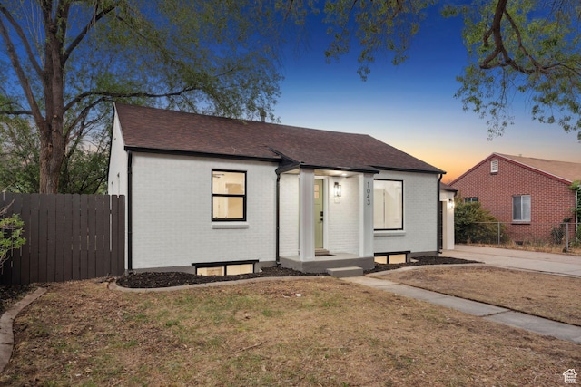1043 S 1300 W, Salt Lake City, UT 84104 - view of front of home featuring brick siding and roof with shingles