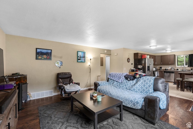 1191 W 4300 S Unit 15A, Taylorsville, UT 84123 - living room featuring wood finished floors and baseboards