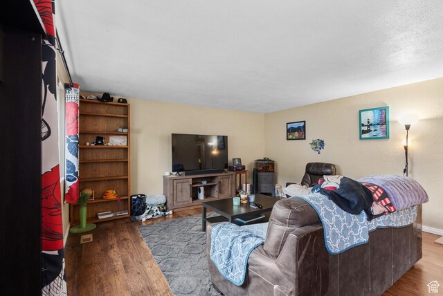 1191 W 4300 S Unit 15A, Taylorsville, UT 84123 - living room featuring wood finished floors