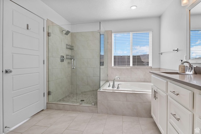 4982 N Goosefoot Dr Unit 51, Eagle Mountain, UT 84005 - full bath featuring tile patterned flooring, vanity, a bath, and a stall shower