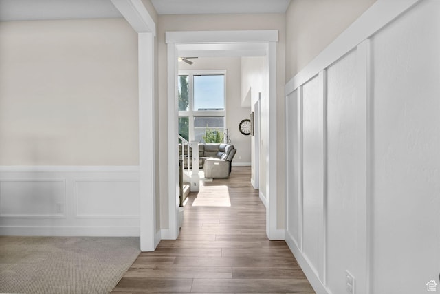4982 N Goosefoot Dr Unit 51, Eagle Mountain, UT 84005 - hall with a decorative wall, wood finished floors, and a wainscoted wall