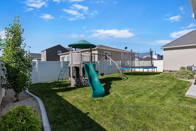 4982 N Goosefoot Dr Unit 51, Eagle Mountain, UT 84005 - communal playground with a trampoline and a fenced backyard