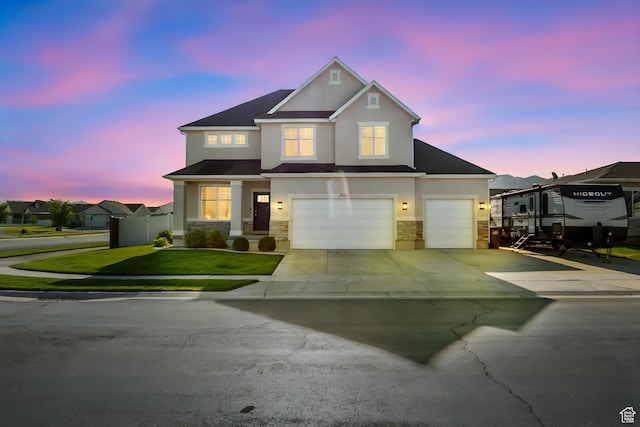 4982 N Goosefoot Dr Unit 51, Eagle Mountain, UT 84005 - traditional home featuring stucco siding, stone siding, driveway, and an attached garage