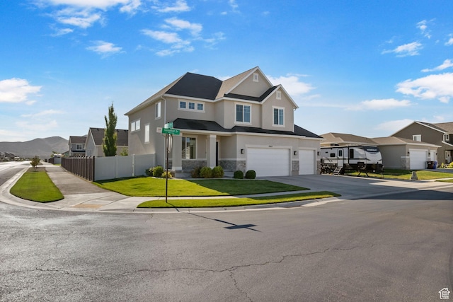 4982 N Goosefoot Dr Unit 51, Eagle Mountain, UT 84005 - view of front of home featuring a garage, stone siding, a residential view, stucco siding, and driveway