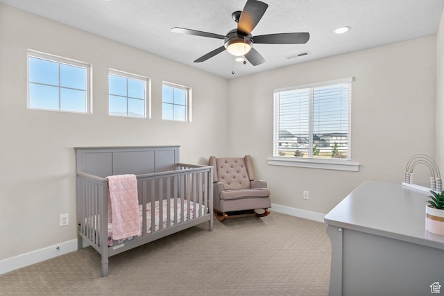 4982 N Goosefoot Dr Unit 51, Eagle Mountain, UT 84005 - carpeted bedroom with a crib, a ceiling fan, and recessed lighting