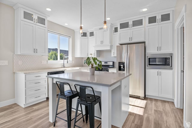 4982 N Goosefoot Dr Unit 51, Eagle Mountain, UT 84005 - kitchen with appliances with stainless steel finishes, light wood-type flooring, white cabinetry, and recessed lighting