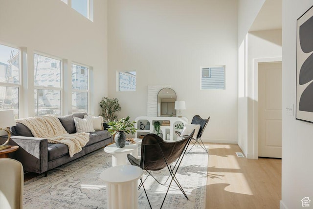 3620 N Stallion St Unit 349, Eagle Mountain, UT 84005 - living room with light wood finished floors and a high ceiling
