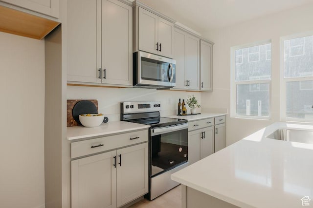 3620 N Stallion St Unit 349, Eagle Mountain, UT 84005 - kitchen featuring appliances with stainless steel finishes and light countertops