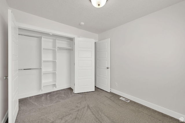 2782 W 4140 S Unit 246, Roy, UT 84067 - unfurnished bedroom featuring carpet floors, a closet, and a textured ceiling