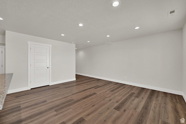 2782 W 4140 S Unit 246, Roy, UT 84067 - spare room featuring wood finished floors, recessed lighting, and a textured ceiling
