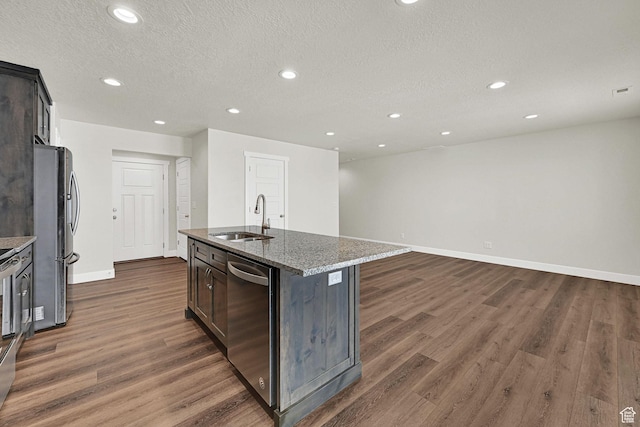 2782 W 4140 S Unit 246, Roy, UT 84067 - kitchen featuring appliances with stainless steel finishes, dark wood finished floors, recessed lighting, stone countertops, and a textured ceiling
