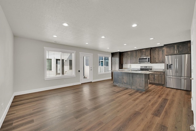 2782 W 4140 S Unit 246, Roy, UT 84067 - kitchen featuring stainless steel appliances, recessed lighting, dark wood-type flooring, dark brown cabinets, and light countertops
