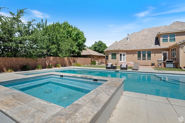 358 S 1040 W, Hurricane, UT 84737 - view of swimming pool with an in-ground hot tub, a fenced backyard, a patio area, and a grill