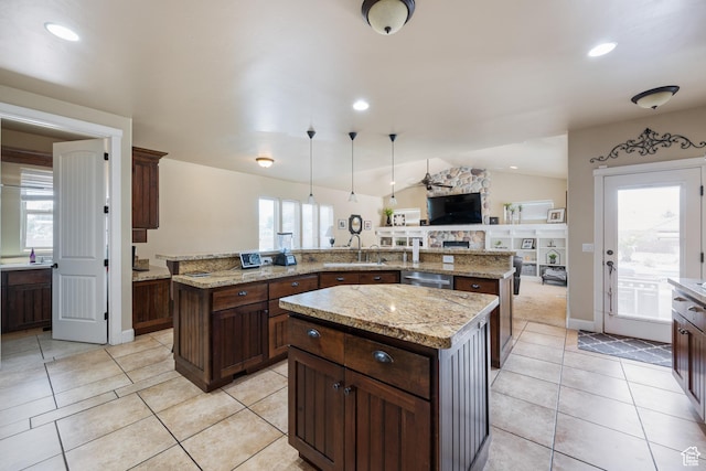 358 S 1040 W, Hurricane, UT 84737 - kitchen with a kitchen island, light tile patterned floors, vaulted ceiling, a stone fireplace, and open floor plan