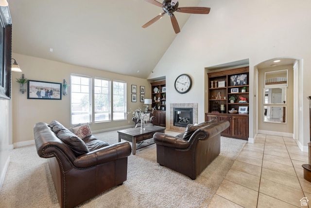 358 S 1040 W, Hurricane, UT 84737 - living area with arched walkways, a fireplace, high vaulted ceiling, a ceiling fan, and light tile patterned flooring