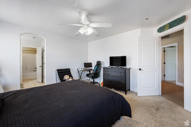 358 S 1040 W, Hurricane, UT 84737 - bedroom featuring arched walkways, a ceiling fan, light colored carpet, and ensuite bath