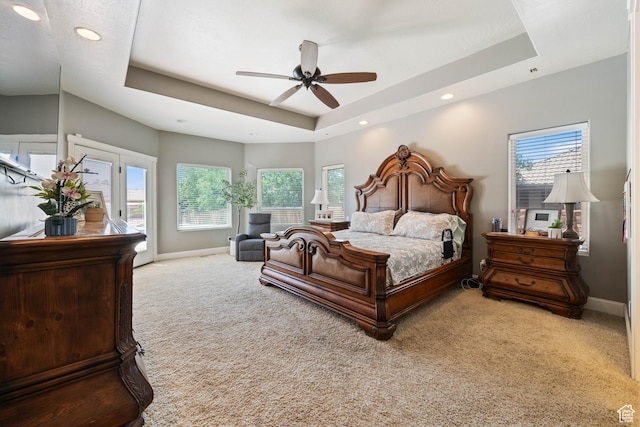 358 S 1040 W, Hurricane, UT 84737 - carpeted bedroom featuring a raised ceiling, multiple windows, access to exterior, recessed lighting, and a ceiling fan